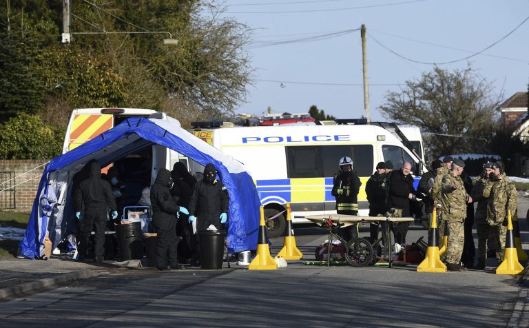 Various police, Army and other emergency service personal attend a scene in Durrington near Salisbury, England, Monday March 19, 2018, as a car is taken away for further investigation into the suspected nerve agent attack on Russian double agent Sergei Skripal and his daughter Yulia.