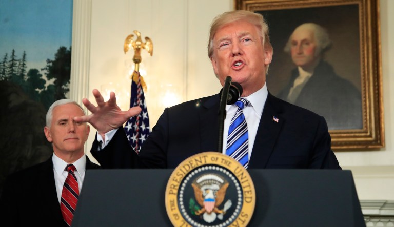 President Trump with Vice President Mike Pence speaks in the Diplomatic Room of the White House in Washington, Friday, March 23, 2018, about the $1.3 trillion spending bill.