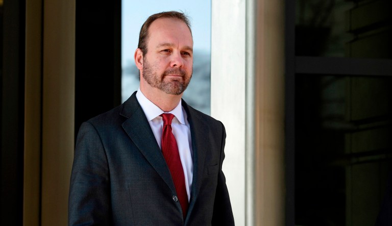 In this Dec. 11, 2017, file photo, Rick Gates, center, departs federal court in Washington. 