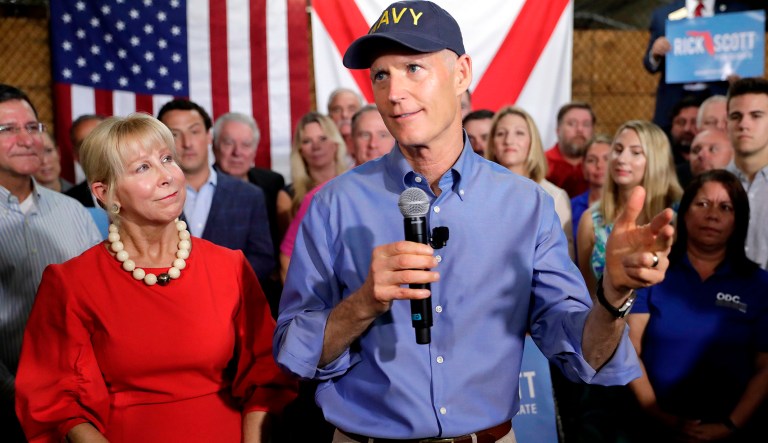 Florida Gov. Rick Scott, with his wife Ann, left, beside him, announces his bid to run for the U.S. Senate at a news conference Monday, April 9, 2018, in Orlando, Fla.