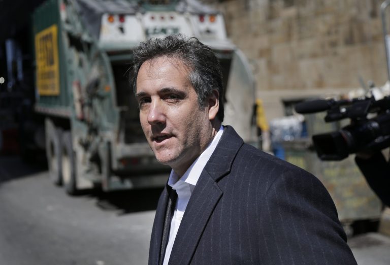 Attorney Michael Cohen walks down the sidewalk in New York on Wednesday. Federal agents who raided the office of President Trump's personal attorney, were looking for information about payments to a former Playboy playmate and a porn actress who claim to have had affairs with Trump, two people familiar with the investigation said.