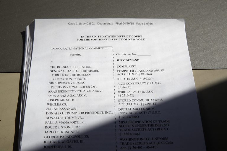 A lawsuit that was filed by the Democratic National Committee is photographed Friday, April 20, 2018, in Washington. The national Democratic Party sued President Donald Trump's campaign, his son, his son-in-law, the Russian Federation and WikiLeaks on Friday, accusing them of an intricate conspiracy to undercut Democrats in the 2016 election by stealing tens of thousands of emails and documents.