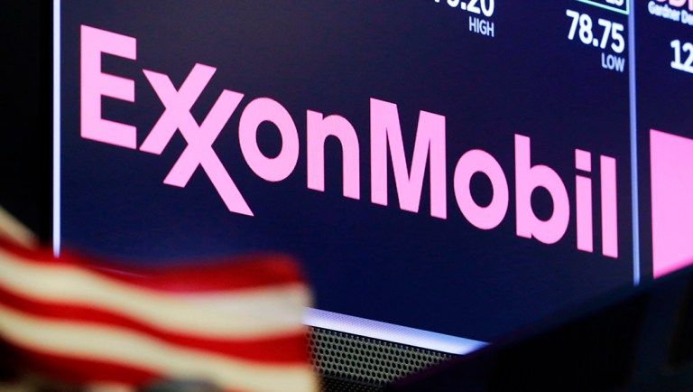 The logo for ExxonMobil appears above a trading post on the floor of the New York Stock Exchange, Monday, April 23, 2018.