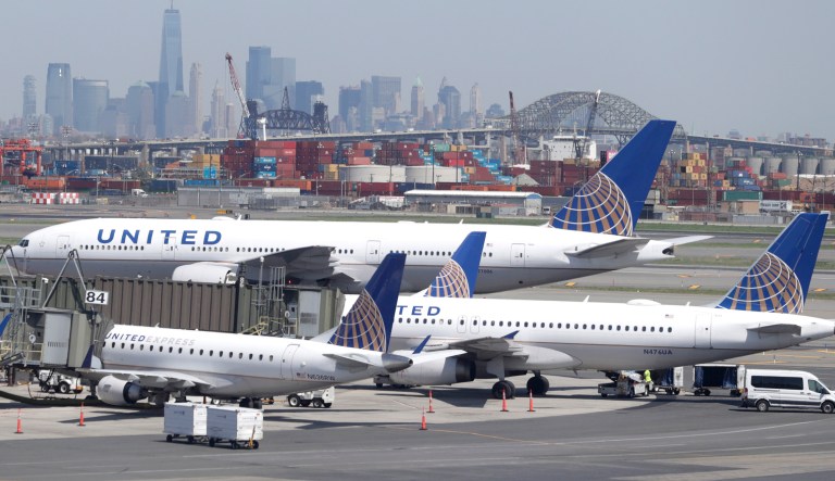 The New York City skyline is seen at a distance as United Airlines jets sit at gates at Newark Liberty International Airport, Wednesday, May 2, 2018, in Newark, N.J. 
