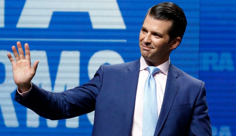 Donald Trump Jr., waves from the stage at the National Rifle Association-Institute for Legislative Action Leadership Forum in Dallas, Friday, May 4, 2018. 