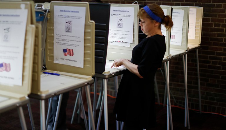 A voter votes at a local precinct on primary election day in Cincinnati. 