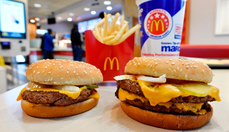FILE- In this March 6, 2018, file photo, a McDonald's Quarter Pounder, left, and Double Quarter Pound burger is shown with fresh beef in Atlanta. McDonaldâs isnât ready to stop offering plastic straws, despite environmental concerns. A shareholder proposal to pressure the worldâs biggest hamburger chain on the matter was voted down at the companyâs annual meeting Thursday, May 24, 2018.