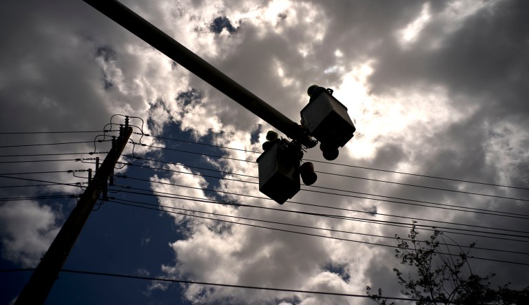 Workers of the electric repair brigade remove old cables in San German, Puerto Rico, Wednesday, May 30, 2018. Federal and Puerto Rican officials are preparing for another catastrophe that cuts power for weeks or months. The Federal Emergency Management Agency is leaving some 600 generators installed in key sites such as hospitals and water pumping stations, more than six times the number before Maria.