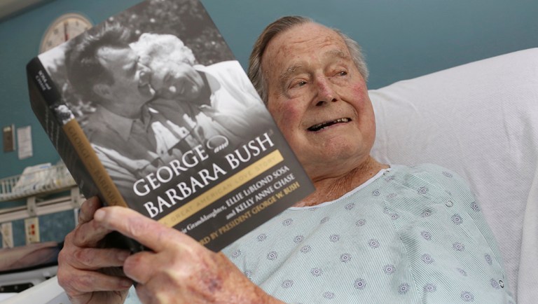 This photo provided by Office of George H. W. Bush shows a photo of former President George H.W. Bush that has tweeted on Friday, June 1, 2018 from his hospital bed while reading a book about himself and his late wife in Biddeford, Maine. The 41st president is 93 and is recovering in a Maine hospital after experiencing low blood pressure and fatigue.   Barbara Bush died in April at age 92. She was married to the former president for 73 years.