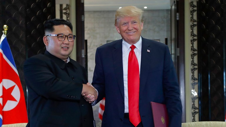 North Korea leader Kim Jong Un and President Trump shake hands after a document signing at the Capella resort on Sentosa Island, Tuesday, June 12, 2018, in Singapore.