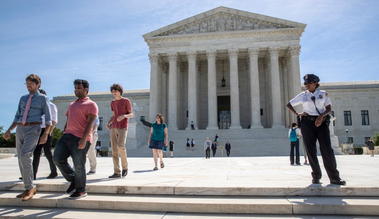 Visitors depart the Supreme Court early Monday. The justices are expected to hand down decisions this week as the court's term comes to a close.