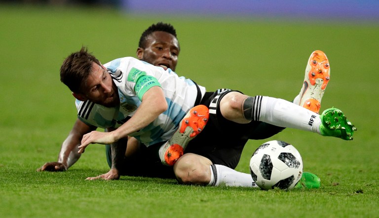 Argentina's Lionel Messi, foreground, and Nigeria's John Obi Mikel compete for the ball during the group D match between Argentina and Nigeria at the 2018 soccer World Cup in the St. Petersburg Stadium in St. Petersburg, Russia, on Tuesday.