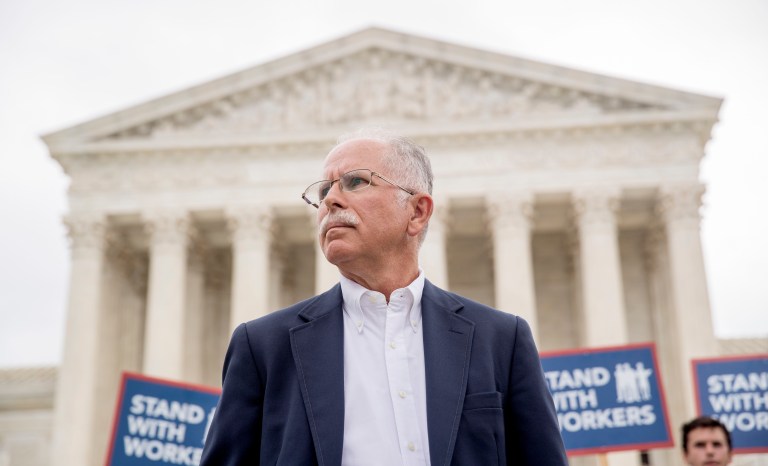 Plaintiff Mark Janus stands outside the Supreme Court after the court rules in a setback for organized labor that states can't force government workers to pay union fees on Wednesday in Washington.