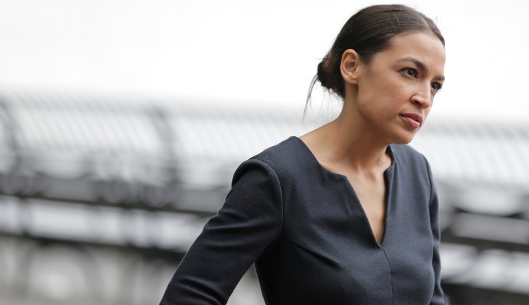 Alexandria Ocasio-Cortez talks to a reporter in New York. 