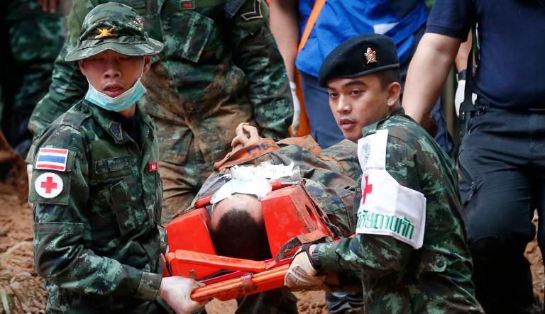 Thai soldiers hold an evacuation drill near the Tham Luang Nang Non cave in Mae Sai, Chiang Rai province, in northern Thailand on June 30, 2018. Rescuers have been searching for 12 boys and their soccer coach missing for seven days in the flooded cave complex.