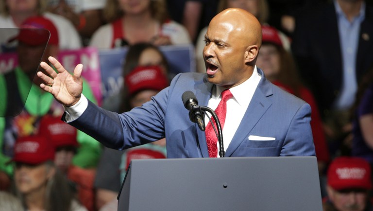 In this May 10, 2018 photo, Curtis Hill, Indiana's Attorney General, warms up the crowd at the Trump and Pence rally in Elkhart, Ind.
