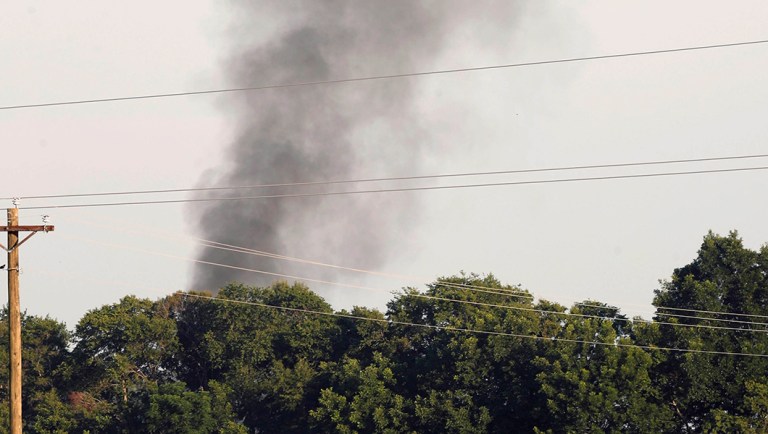 In this July 10, 2017 file photograph, smoke rises in the air after a KC-130T military transport plane crashed into a field near Itta Bena, Miss.