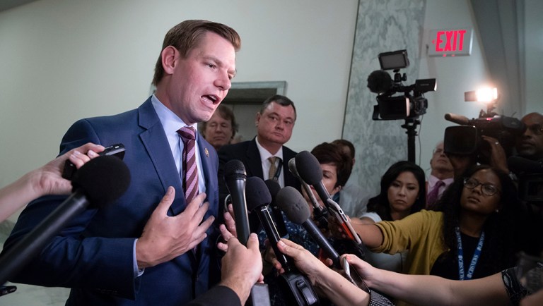 Rep. Eric Swalwell, D-Calif., pauses to speak with reporters.