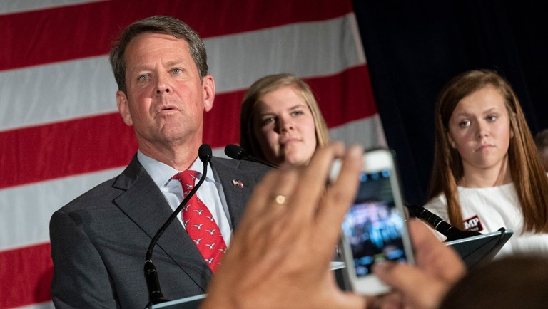Brian Kemp appears during a unity rally.
