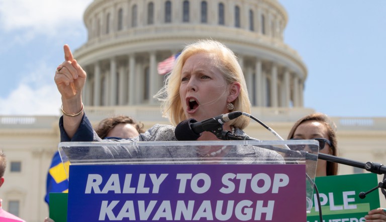 Sen. Kirsten Gillibrand, D-N.Y., joins protesters objecting to President Trump's Supreme Court nominee Brett Kavanaugh at a rally in Washington, Aug. 1, 2018.