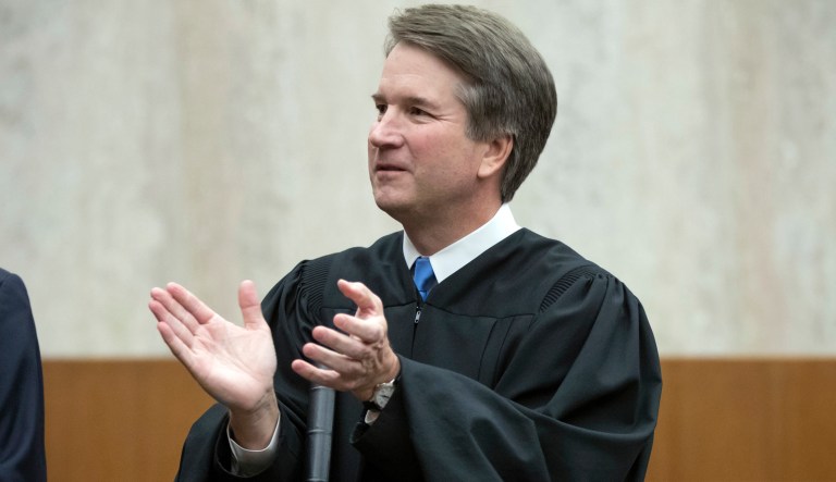 President Donald Trump's Supreme Court nominee, Judge Brett Kavanaugh, officiates at the swearing-in of Judge Britt Grant to take a seat on the U.S. Court of Appeals for the Eleventh Circuit, Tuesday, Aug. 7, 2018, at the U.S. District Courthouse in Washington. 