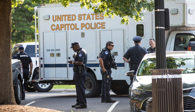 U.S. Capitol Police officers stand in a parking lot in Washington, D.C.