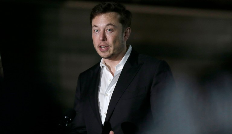 FILE- In this June 14, 2018, file photo Tesla CEO and founder of the Boring Company Elon Musk speaks at a news conference in Chicago. Musk says he's in talks with the Saudi Arabian sovereign wealth fund about taking the electric car and solar panel maker private, but no deal has been finalized. Musk says in a blog posted Monday, Aug. 13, that most of the funding would be in stock rather than debt.