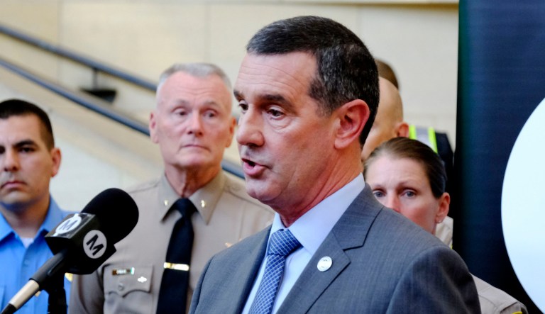 The Transportation Security Administration's administrator, David P. Pekoske (center), talks during a news conference.
