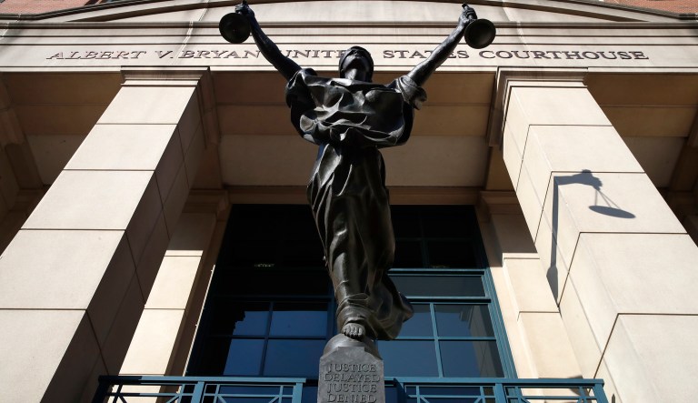 A statue of "Justice" is seen at federal court as closing arguments are expected in the trial of former Trump campaign chairman Paul Manafort, in Alexandria, Va., Wednesday, Aug. 15, 2018.