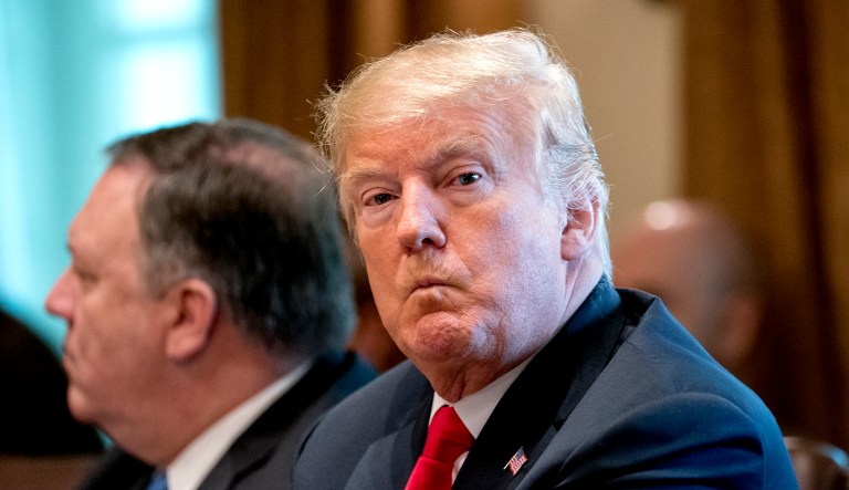 President Trump, accompanied by Secretary of State Mike Pompeo, left, attends a Cabinet meeting in the Cabinet Room of the White House in Washington.
