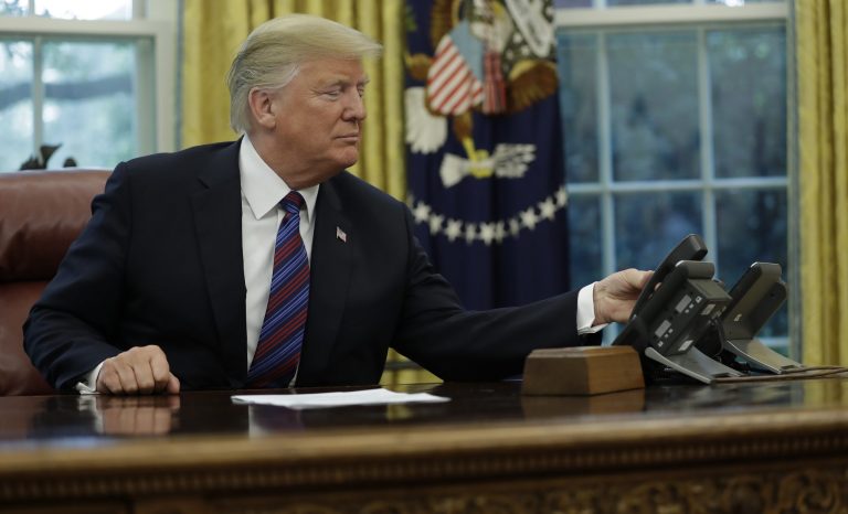 President Donald Trump talks on the phone with Mexican President Enrique Pena Nieto, in the Oval Office of the White House, Monday, Aug. 27, 2018, in Washington. Trump is announcing a trade "understanding" with Mexico that could lead to an overhaul of the North American Free Trade Agreement. Trump made the announcement Monday in the Oval Office, with Mexican President Enrique Pena Nieto joining by speakerphone.