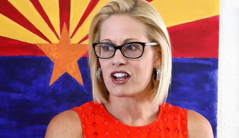 Rep. Kyrsten Sinema, D-Ariz., talks to campaign volunteers at a Democratic campaign office on primary election day Tuesday, Aug. 28, 2018, in Phoenix. Sinema is seeking the current U.S. Senate seat occupied by outgoing Republican Sen. Jeff Flake, and will face the Republican primary winner of the race between Rep. Martha McSally, former state Sen. Kelli Ward, and former Maricopa County Sheriff Joe Arpaio, if Sinema wins the Democratic primary.