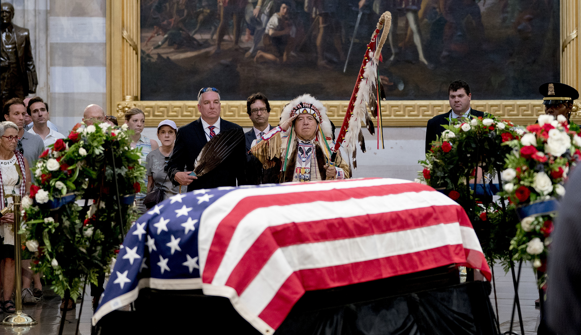 Glynn Crooks (Wambdi Ho'Waste), a tribal leader of the Shakopee Mdewakanton Sioux community and a Vietnam War veteran, pays his respects to Sen. John McCain, R-Ariz., as he lies in state in the Rotunda of the U.S. Capitol, Friday, Aug. 31, 2018, in Washington.
