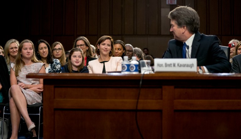 President Trump's Supreme Court nominee, Brett Kavanaugh, looks back at his family as he appears before the Senate Judiciary Committee on Capitol Hill in Washington, Sept. 4, 2018.