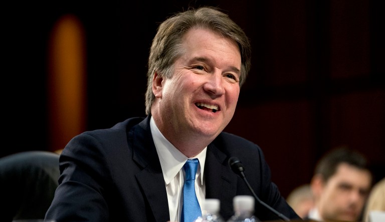 President Trump's Supreme Court nominee Brett Kavanaugh smiles while testifying before the Senate Judiciary Committee on Capitol Hill.