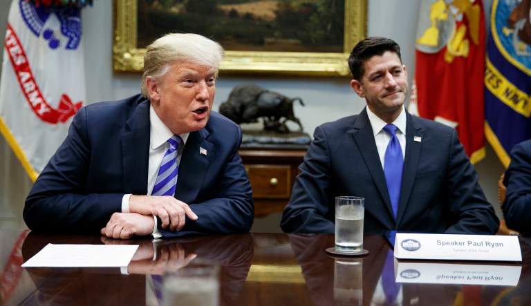 Speaker of the House Rep. Paul Ryan, R-Wis., listens to President Trump speak during a meeting with Republican lawmakers in the Roosevelt Room of the White House on Wednesday in Washington. 