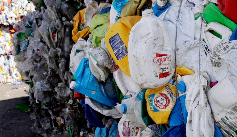 Bundled plastic goods, which were separated from paper and metal recyclable materials, are stacked and awaiting processing at EL Harvey & Sons, a waste and recycling company, in Westborough, Mass. 