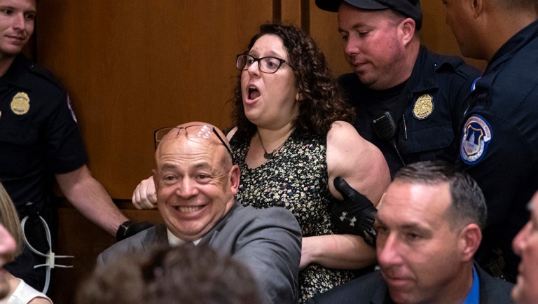 A protester disrupts the confirmation hearing of President Trump's Supreme Court nominee Brett Kavanaugh.