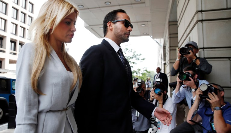 Former Donald Trump presidential campaign adviser George Papadopoulos, who triggered the Russia investigation, and who pleaded guilty to one count of making false statements to the FBI walks with his wife Simona Mangiante, left, as they arrive at federal court for sentencing, Friday, Sept. 7, 2018, in Washington.