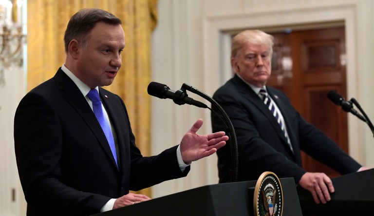 President Trump, right, listens as Polish President Andrzej Duda, left, speaks during a joint news conference in the East Room of the White House in D.C.