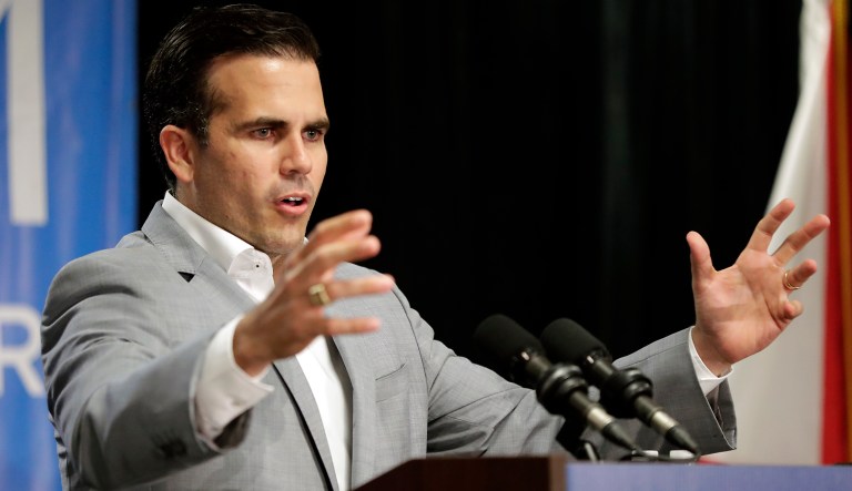 Puerto Rico Governor Ricardo Rossello endorses Florida Democratic gubernatorial candidate Andrew Gillum at a campaign rally Monday Oct. 1, 2018, in Kissimmee, Fla.