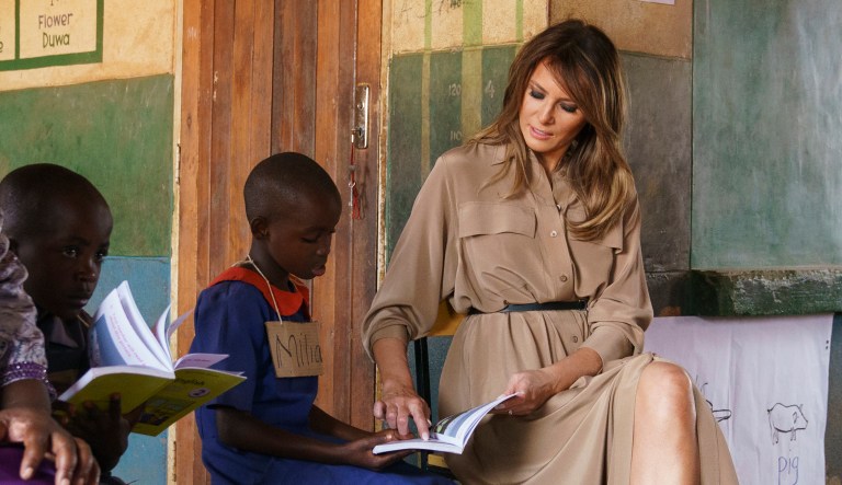 First lady Melania Trump helps a student as she visits a language class at Chipala Primary School, in Lilongwe, Malawi,, on Thursday.