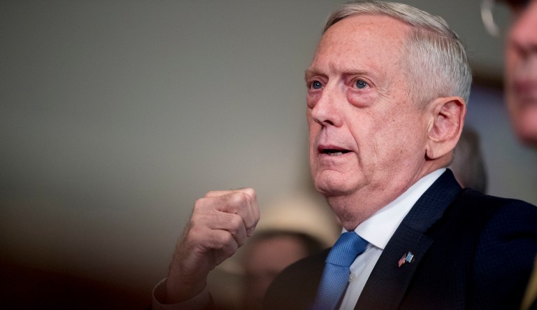 Defense Secretary Jim Mattis, left, speaks to reporters at the Pentagon, Tuesday, Oct. 9, 2018, in Washington. 