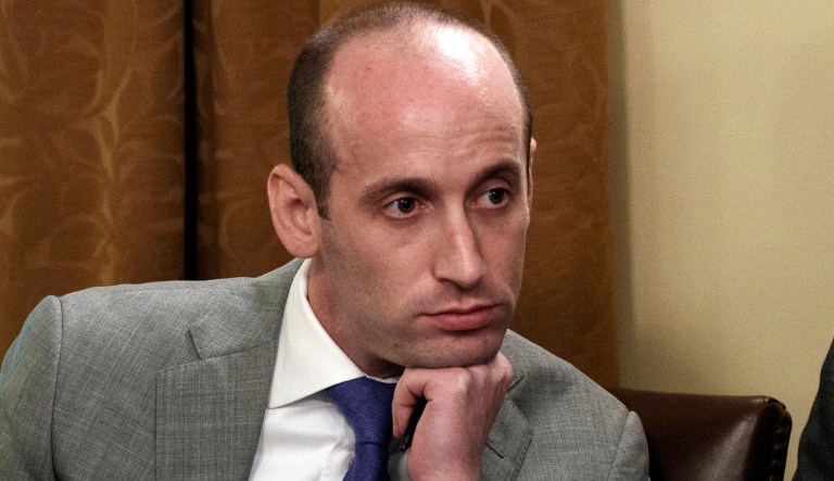In this June 21, 2018 file photo, White House senior adviser Stephen Miller listens as President Donald Trump speaks during a cabinet meeting at the White House in Washington. A California school district has suspended a teacher who recounted how Miller ate glue as a third-grader. Nikki Fiske told the Hollywood Reporter that when Miller was a student in her Santa Monica, Calif., classroom, he was a loner with a messy desk who played with glue. The Los Angeles Times says the Santa Monica-Malibu Unified School District placed Fiske on "home assignment" while it decides what to do, if anything, about the disclosures.