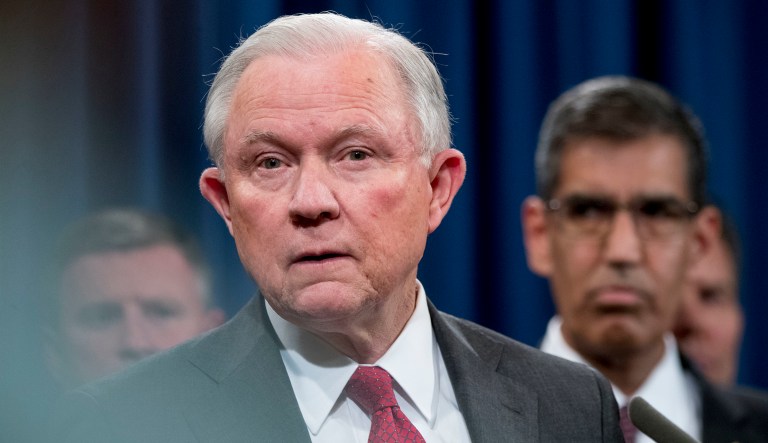 Attorney General Jeff Sessions listens to a question from a reporter during a news conference, Tuesday, Oct. 16, 2018, at the Justice Department in Washington.