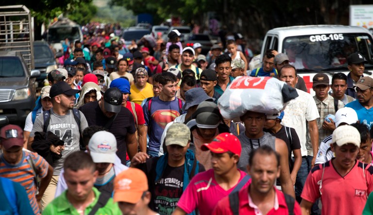 Honduran migrants walk toward the U.S. as they arrive at Chiquimula, Guatemala, on Tuesday.