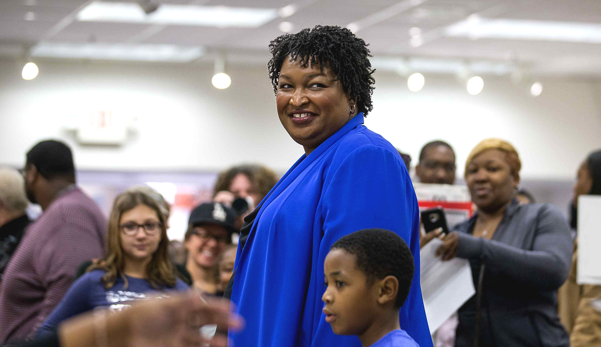 Georgia gubernatorial candidate Stacey Abrams prepares to vote during early voting at The Gallery at South DeKalb Mall in Decatur on Oct. 22, 2018.