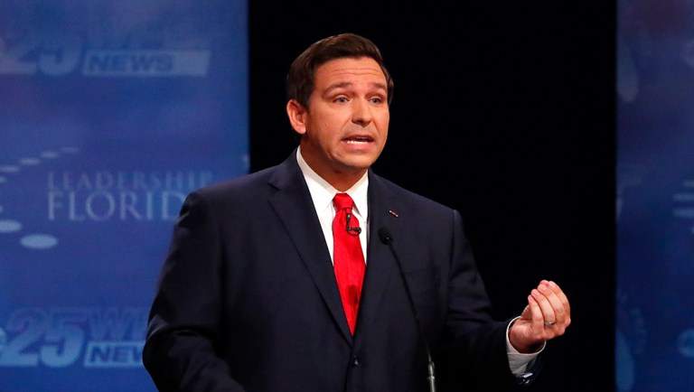 Florida Republican gubernatorial candidate Ron DeSantis gestures as he debates.
