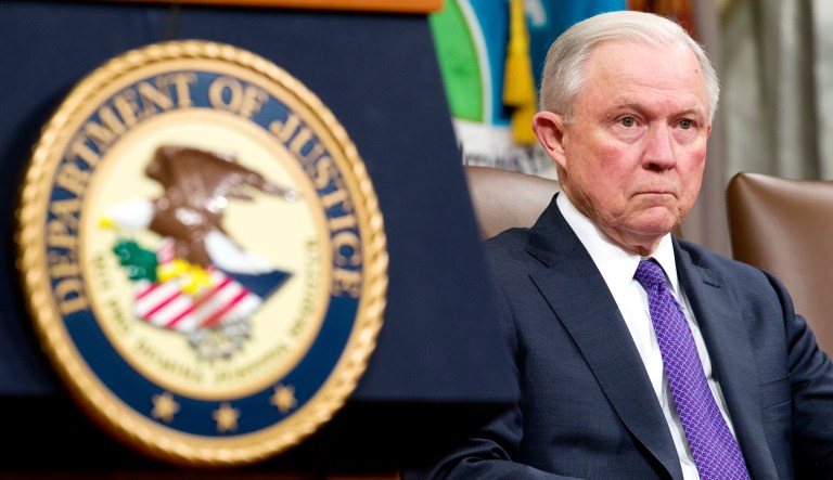 Attorney General Jeff Sessions is seated during an event in D.C.