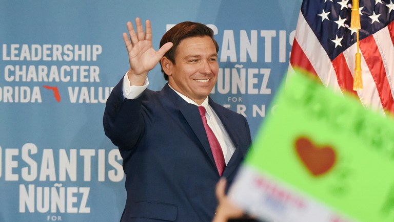 Florida Republican gubernatorial candidate Ron DeSantis greets the crowd as he takes the stage for his Jacksonville campaign rally.